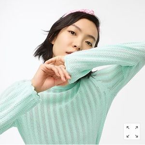 Pointelle ruffle mock neck sweater